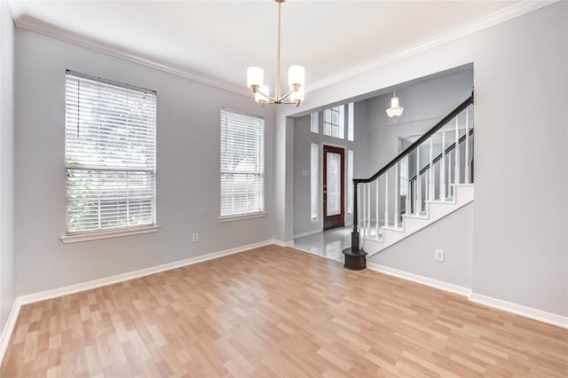 16023 Cutten Rd, Houston, TX 77070 - entryway featuring wood finished floors, crown molding, a chandelier, and stairs