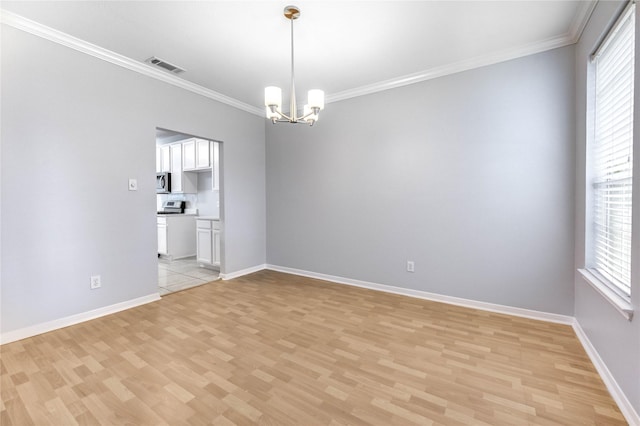 16023 Cutten Rd, Houston, TX 77070 - empty room featuring light wood finished floors, plenty of natural light, crown molding, and a chandelier