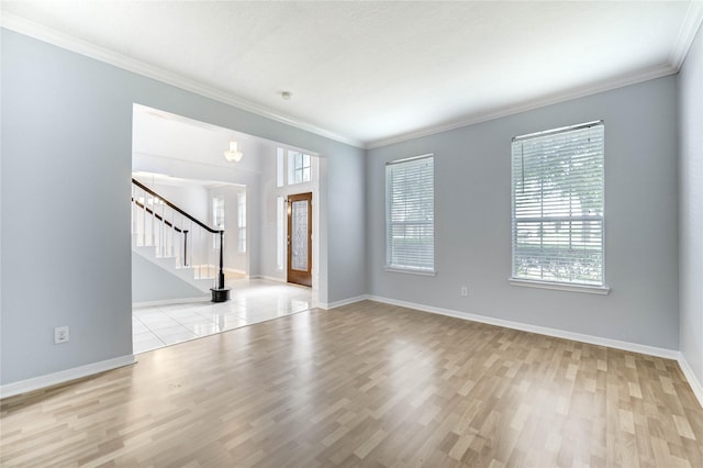 16023 Cutten Rd, Houston, TX 77070 - spare room featuring wood finished floors, stairway, and crown molding