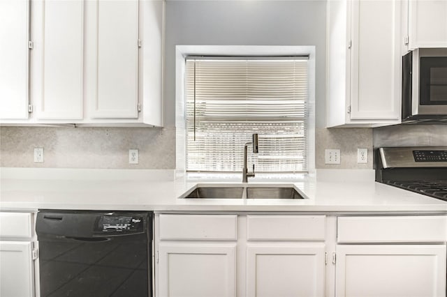 16023 Cutten Rd, Houston, TX 77070 - kitchen featuring stainless steel microwave, dishwasher, stove, and white cabinetry