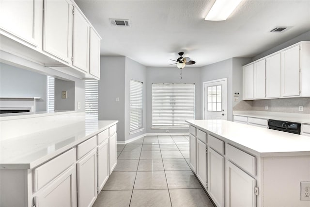 16023 Cutten Rd, Houston, TX 77070 - kitchen featuring a ceiling fan, black dishwasher, light countertops, and white cabinetry