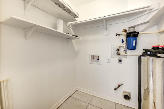 16023 Cutten Rd, Houston, TX 77070 - laundry room featuring washer hookup, light tile patterned flooring, hookup for a gas dryer, and hookup for an electric dryer