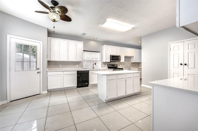 16023 Cutten Rd, Houston, TX 77070 - kitchen with stainless steel appliances, healthy amount of natural light, and white cabinetry