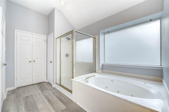 16023 Cutten Rd, Houston, TX 77070 - full bathroom with a jetted tub, a shower stall, and wood finished floors
