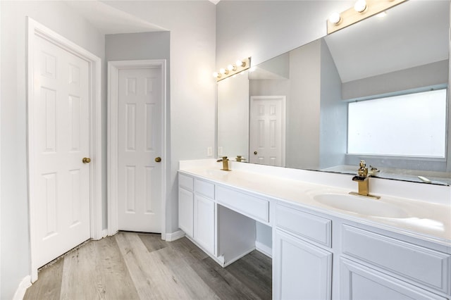 16023 Cutten Rd, Houston, TX 77070 - bathroom featuring double vanity and wood finished floors