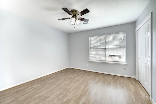 16023 Cutten Rd, Houston, TX 77070 - unfurnished bedroom featuring wood finished floors, a closet, and ceiling fan