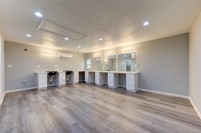 16023 Cutten Rd, Houston, TX 77070 - unfurnished office featuring attic access, a wall mounted air conditioner, built in desk, light wood-type flooring, and recessed lighting