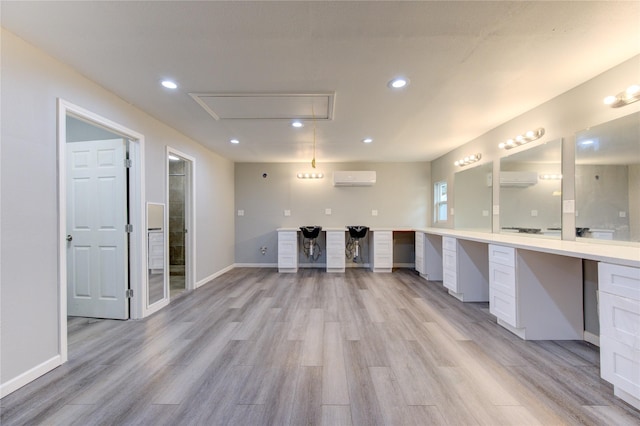 16023 Cutten Rd, Houston, TX 77070 - unfurnished office featuring attic access, recessed lighting, light wood-style floors, an AC wall unit, and built in desk