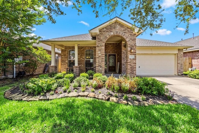 4472 Gerona St, League City, TX 77573 - view of front of property featuring brick siding, a garage, and driveway