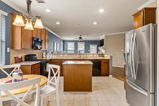 4472 Gerona St, League City, TX 77573 - kitchen featuring black appliances, crown molding, a kitchen island, a peninsula, and decorative backsplash