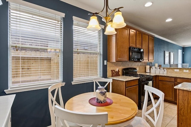 4472 Gerona St, League City, TX 77573 - kitchen with black appliances, brown cabinetry, crown molding, plenty of natural light, and recessed lighting