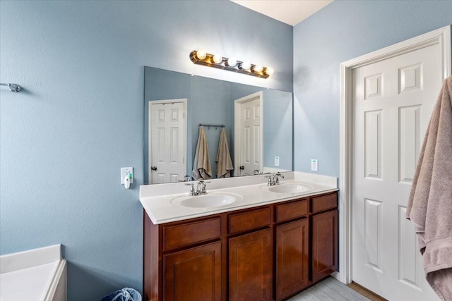 4472 Gerona St, League City, TX 77573 - bathroom featuring double vanity and wood finished floors