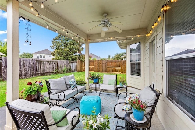 4472 Gerona St, League City, TX 77573 - fenced backyard featuring outdoor lounge area, a ceiling fan, and a patio area