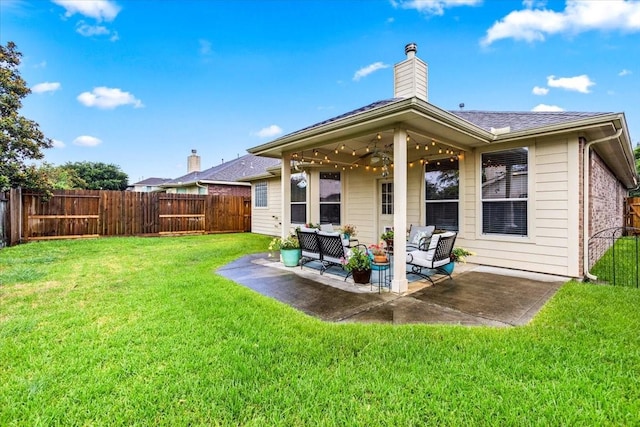 4472 Gerona St, League City, TX 77573 - back of house featuring outdoor lounge area, a fenced backyard, a patio area, a chimney, and roof with shingles