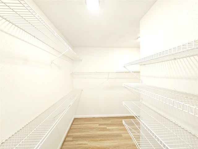 14519 Cypress Valley Dr, Cypress, TX 77429 - walk in closet with wood finished floors
