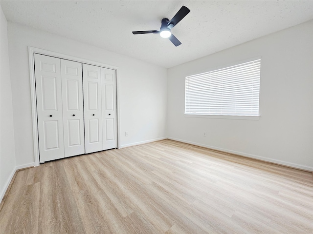 14519 Cypress Valley Dr, Cypress, TX 77429 - unfurnished bedroom with wood finished floors, a closet, and a ceiling fan