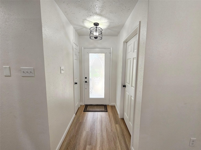 14519 Cypress Valley Dr, Cypress, TX 77429 - entryway with light wood finished floors and a textured wall