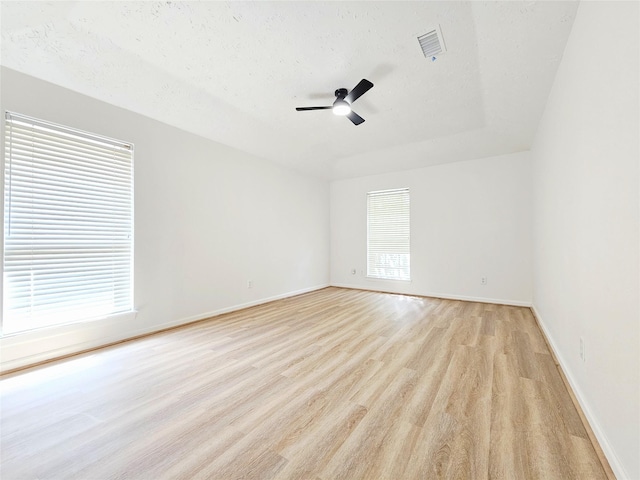 14519 Cypress Valley Dr, Cypress, TX 77429 - spare room featuring light wood-style flooring, ceiling fan, and a textured ceiling