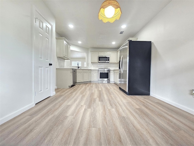 14519 Cypress Valley Dr, Cypress, TX 77429 - kitchen with stainless steel appliances, light wood-style flooring, light countertops, and recessed lighting