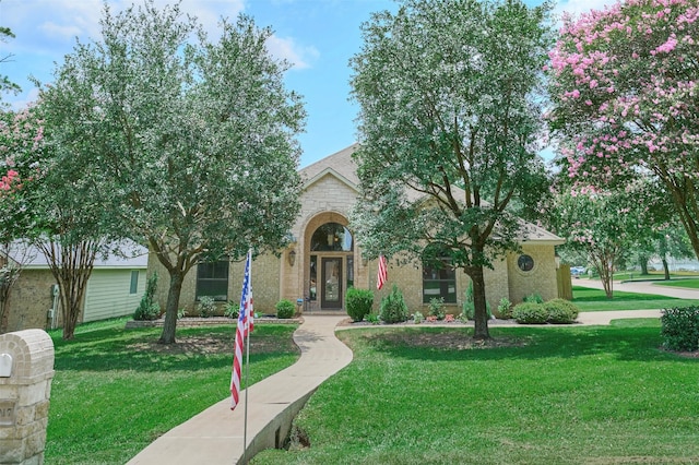 11917 Walden Rd, Montgomery, TX 77356 - obstructed view of property featuring a front lawn and stone siding