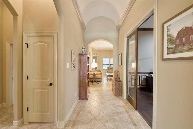 11917 Walden Rd, Montgomery, TX 77356 - hallway with arched walkways, crown molding, french doors, and vaulted ceiling