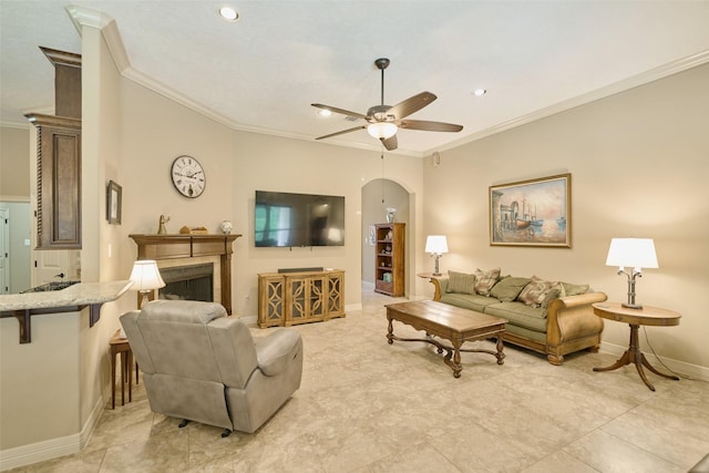 11917 Walden Rd, Montgomery, TX 77356 - living area featuring a ceiling fan, ornamental molding, recessed lighting, a fireplace, and light tile patterned floors