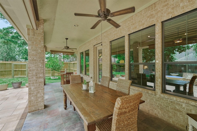 11917 Walden Rd, Montgomery, TX 77356 - view of patio / terrace with a ceiling fan and outdoor dining space