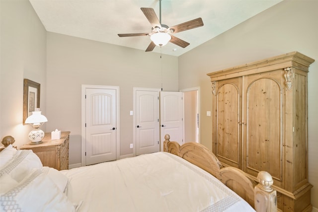 11917 Walden Rd, Montgomery, TX 77356 - bedroom featuring a ceiling fan, multiple closets, and high vaulted ceiling