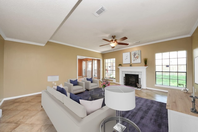 3107 Dulaney Rd, Houston, TX 77084 - tiled living area with a fireplace, crown molding, and a ceiling fan