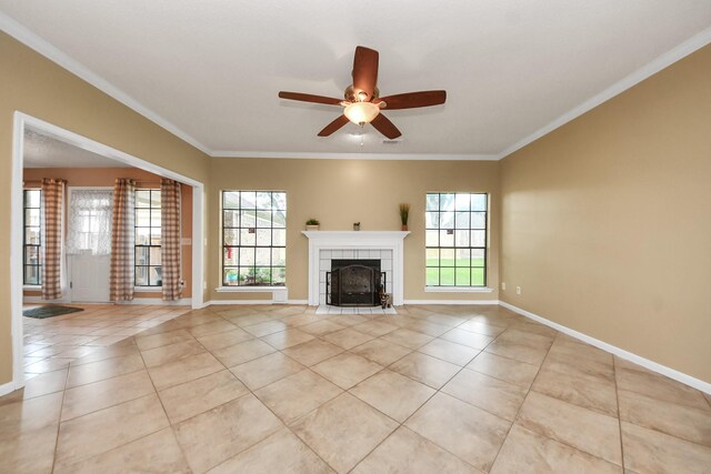 3107 Dulaney Rd, Houston, TX 77084 - unfurnished living room with light tile patterned flooring, a ceiling fan, crown molding, and a tiled fireplace