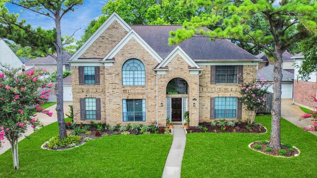 3107 Dulaney Rd, Houston, TX 77084 - view of front of property featuring brick siding, a front lawn, and roof with shingles