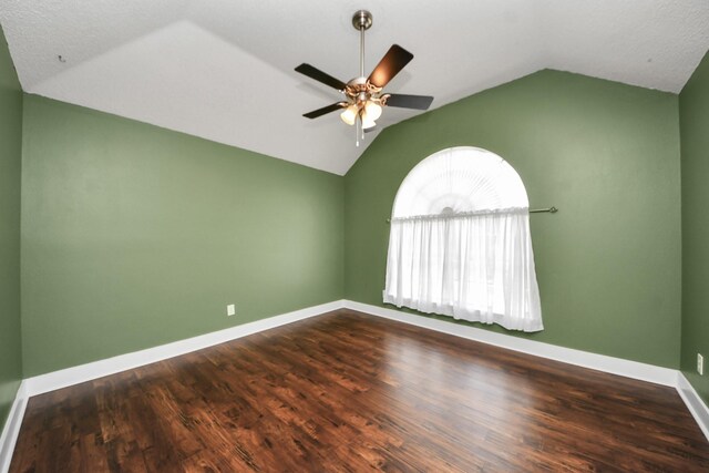 3107 Dulaney Rd, Houston, TX 77084 - unfurnished room featuring vaulted ceiling, a ceiling fan, and dark wood-style flooring