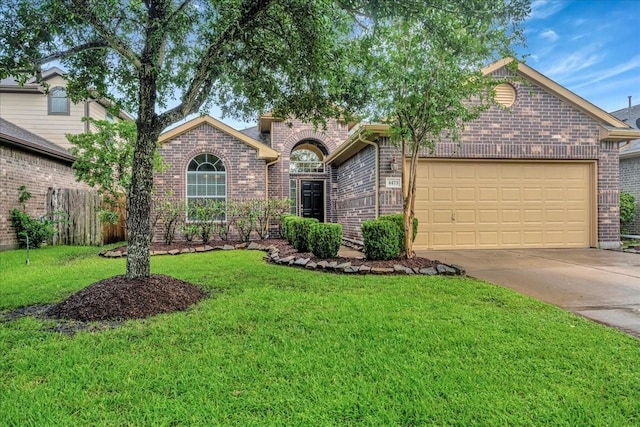 4473 Gran Canary Dr, League City, TX 77573 - view of front of property featuring brick siding, an attached garage, and concrete driveway