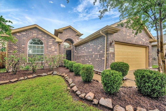 4473 Gran Canary Dr, League City, TX 77573 - view of front of home featuring brick siding, a garage, and a front lawn