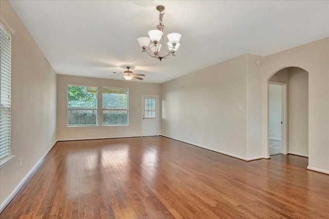 4473 Gran Canary Dr, League City, TX 77573 - spare room with arched walkways, wood finished floors, a chandelier, and ceiling fan