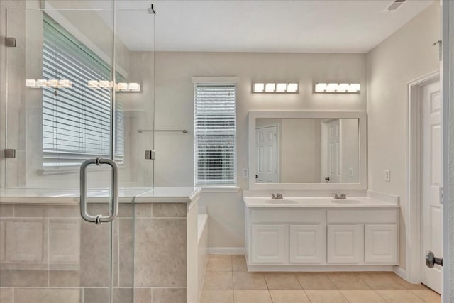 4473 Gran Canary Dr, League City, TX 77573 - full bathroom with double vanity, tile patterned floors, a stall shower, and a bath
