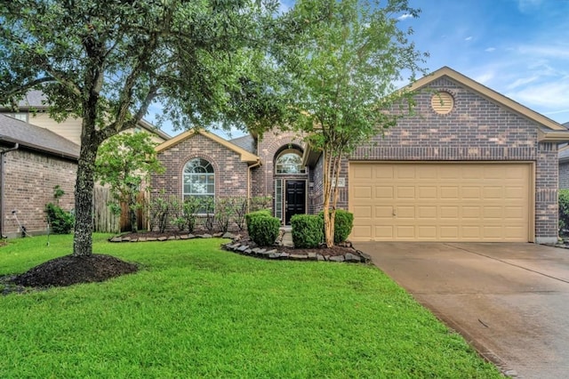 4473 Gran Canary Dr, League City, TX 77573 - view of front of house with brick siding, an attached garage, driveway, and a front lawn