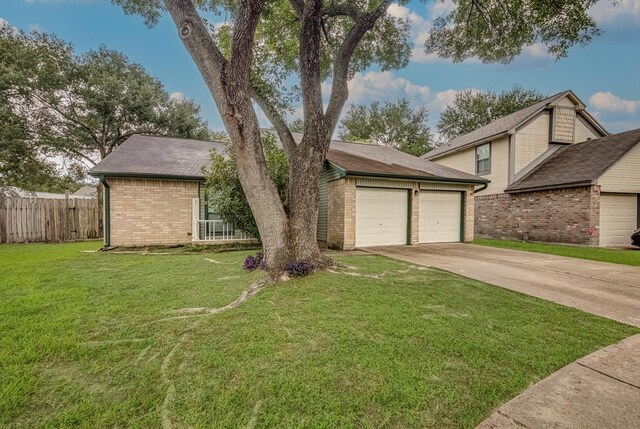 22307 Silver Morning Cir, Katy, TX 77450 - view of front of home featuring concrete driveway, brick siding, and a garage