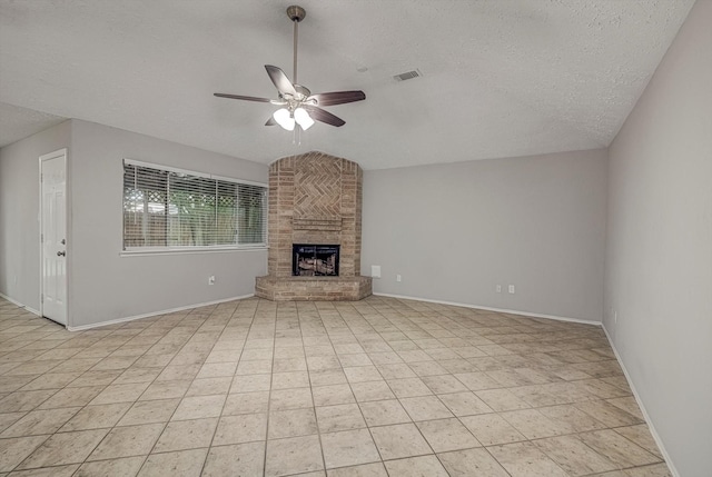 22307 Silver Morning Cir, Katy, TX 77450 - unfurnished living room with a textured ceiling, ceiling fan, and a brick fireplace