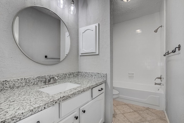22307 Silver Morning Cir, Katy, TX 77450 - bathroom featuring a textured wall, vanity, and shower / washtub combination