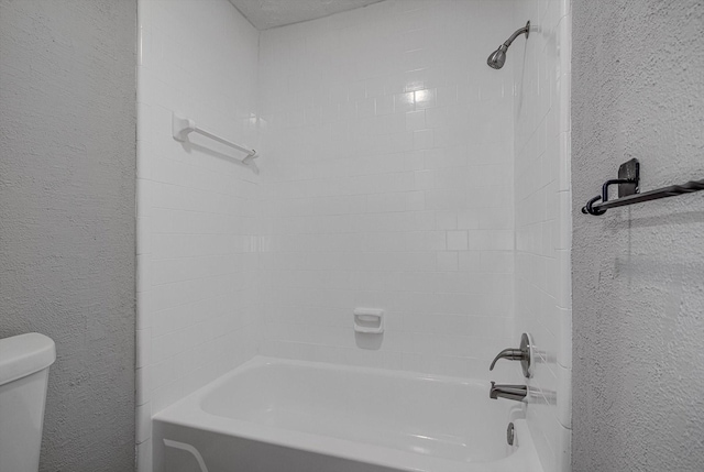 22307 Silver Morning Cir, Katy, TX 77450 - bathroom with a textured wall and tub / shower combination
