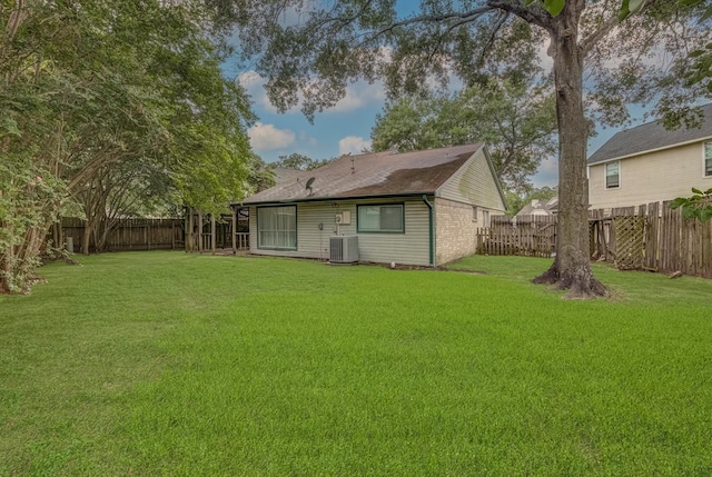22307 Silver Morning Cir, Katy, TX 77450 - back of house with a fenced backyard and a shingled roof