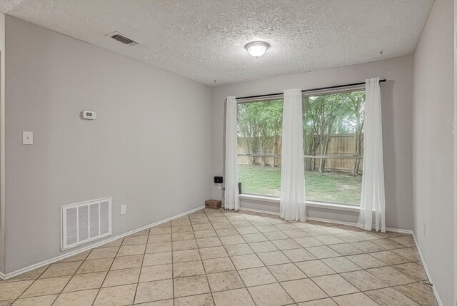 22307 Silver Morning Cir, Katy, TX 77450 - spare room featuring light tile patterned floors and a textured ceiling