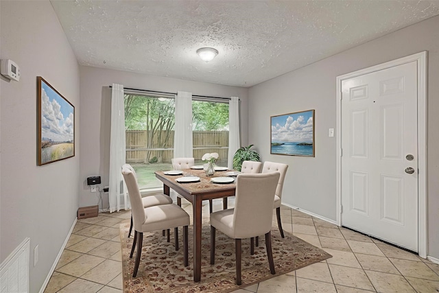 22307 Silver Morning Cir, Katy, TX 77450 - dining area featuring light tile patterned floors and a textured ceiling