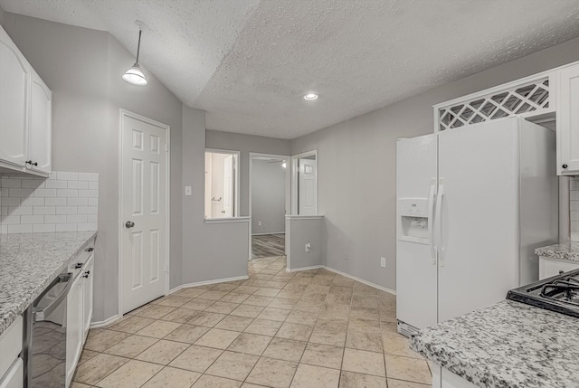 22307 Silver Morning Cir, Katy, TX 77450 - kitchen with a textured ceiling, white cabinets, backsplash, dishwashing machine, and white fridge with ice dispenser