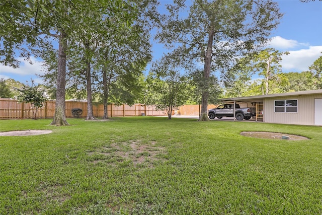 14590 N Tram Rd, Splendora, TX 77372 - view of yard featuring a carport