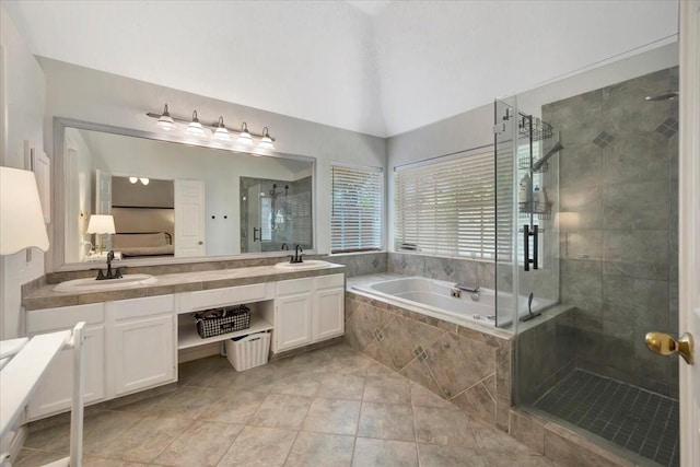 14523 Hillside Hickory Ct, Houston, TX 77062 - bathroom with a garden tub, a shower stall, double vanity, tile patterned flooring, and lofted ceiling
