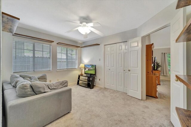 14523 Hillside Hickory Ct, Houston, TX 77062 - living area with ceiling fan, light carpet, and plenty of natural light
