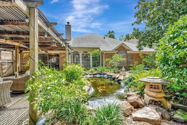 14523 Hillside Hickory Ct, Houston, TX 77062 - view of yard featuring a garden pond and a pergola