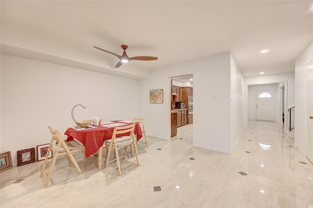 14143 Lost Meadow Ln, Houston, TX 77079 - dining area with light marble finish floors, ceiling fan, and recessed lighting
